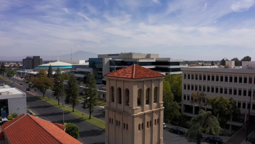 Aerial close-up panning shot of a belltower in downtown Bakersfield, California. 4K