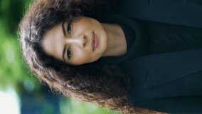 Portrait of a hispanic young woman looking at camera. South American Latina female 30s person in Vertical Video - Powered by Shutterstock - Get 15% off with code: PIKWIZARD15