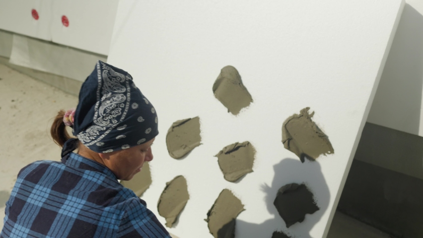 Insulation of the walls of the house with foam.