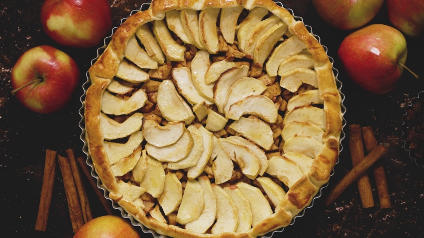 Homemade apple pie on dark rustic background, top view. Classic autumn dessert Royalty-Free Stock Footage #1094190153
