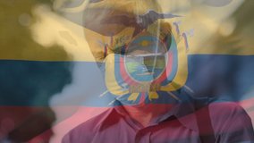 Animation of flag of equador waving over caucasian man wearing face mask in city street. global health precautions during covid 19 pandemic concept digitally generated video.