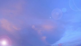 Bokeh sun light ray n bright lens flare sunbeam shine through pastel pink cloud n colorful cloudscap on sunrise or sunset blue sky in tropical summer sunlight n sunray, 4k cinemagraph b-roll TimeLapse - Powered by Shutterstock - Get 15% off with code: PIKWIZARD15