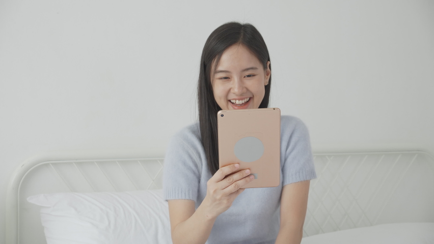 Young asian woman using digital tablet computer for video conference online with friends, businesswoman working with video call for meeting with social network, business and communication concept. | Shutterstock HD Video #1094196337