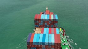 cargo container ship full speed in sea to export goods and distributing products to dealer and consumers across Asia pacific and Europe. by container ship Transport business service.4k video top view 