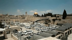 An extreme wide shot of the whole Western Wall site and the temple mount with al-Aqsa Mosque in the old city of Jerusalem. an NTSC video clip, Jerusalem, Israel.