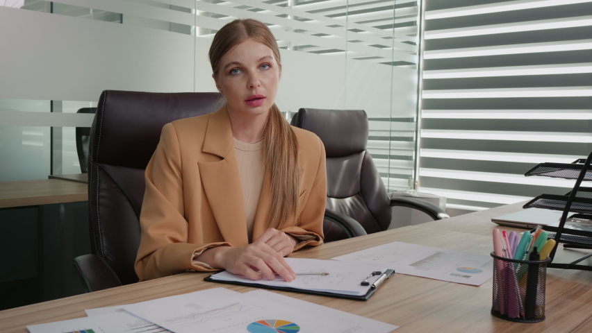 POV businesswoman talking on video call conference in office looking at camera. Business advisor blogging in office on an accounting matter. | Shutterstock HD Video #1094221809