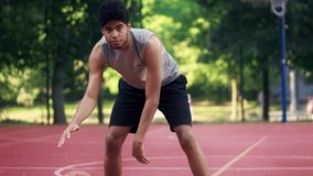 Serious basketball player dribbling ball staring at rival pov, sport competition - Powered by Shutterstock - Get 15% off with code: PIKWIZARD15