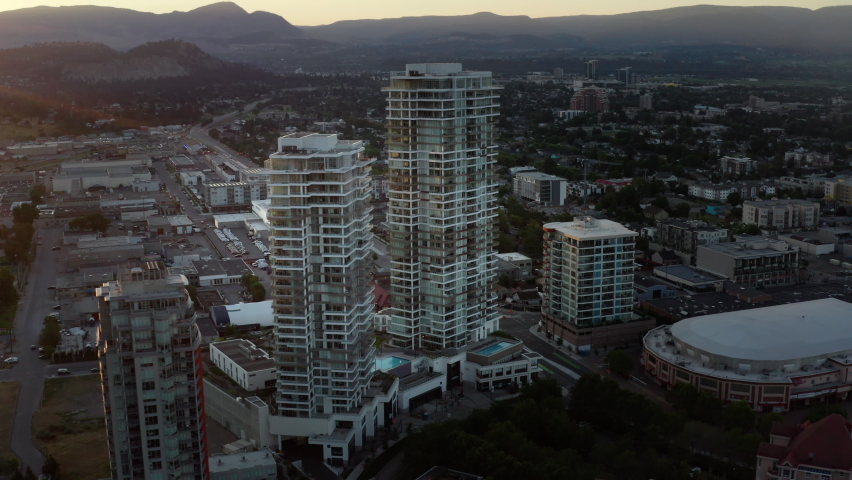 Aerial footage of Downtown Kelowna buildings, developing city, sunrise