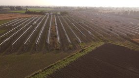 4k video aerial drone footage of solar pannels in a field in Italy