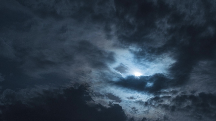 Nighttime Timelapse. There is a full moon and black clouds in the sky. Beautiful moonlight and twinkling stars | Shutterstock HD Video #1094244943