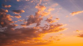 sunrise Sunset Time Lapse. 4K Time-Lapse In Yellow Orange Pink Colors. vibrant colors sunrise Sky With Fluffy Clouds. Sunset Sky in pink orange blue colors Background. Dramatic Sky. - Powered by Shutterstock - Get 15% off with code: PIKWIZARD15