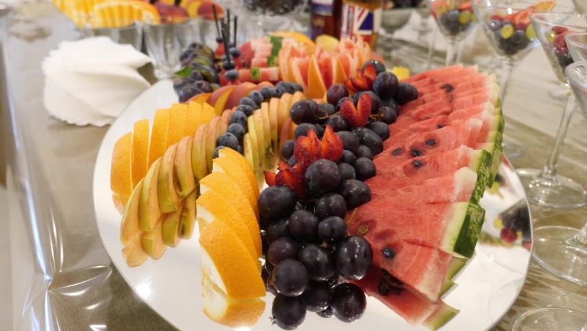 Fruit table. Grapes, pineapples, oranges, tangerines, etc. Buffet table design. Ukraine. Lviv (6.08.22)