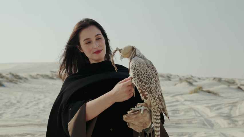 woman interacting with Qatari Falcon bird in Doha Qatar desert
 Royalty-Free Stock Footage #1094261107