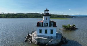 09-08-2022 - Town of Esopus, NY,  Aerial video, low altitude orbit or arc with rising movement around, the historic Esopus Meadows Lighthouse located on the Hudson River.

