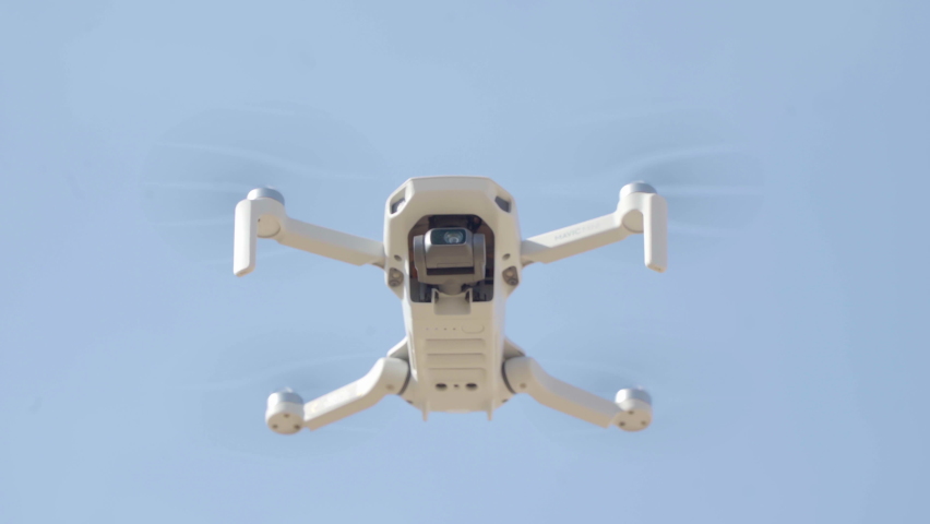 Drone flying outdoor. Analyzing the Field, then leaves