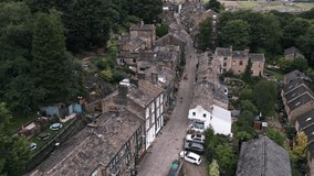 Drone aerial overhead video taken at Haworth Village of the main street in West Yorkshire. Home of the famous Bronte family.