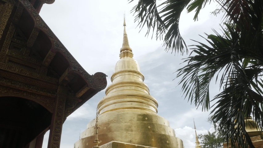 beautiful view inside of Wat Phra Singha temple with golden glow pagoda. Southeast asia life in Chiang Mai,Thailand.