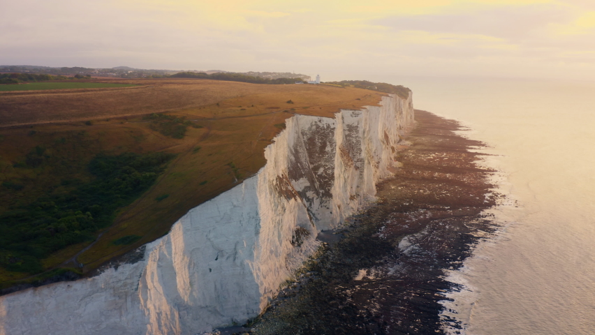 Beautiful aerial over the white cliffs of Dover. Seven Sisters - The white cliffs at the South coast of England. White Cliffs of Dover. Seven Sisters National park, East Sussex, England south coast. Royalty-Free Stock Footage #1094273059