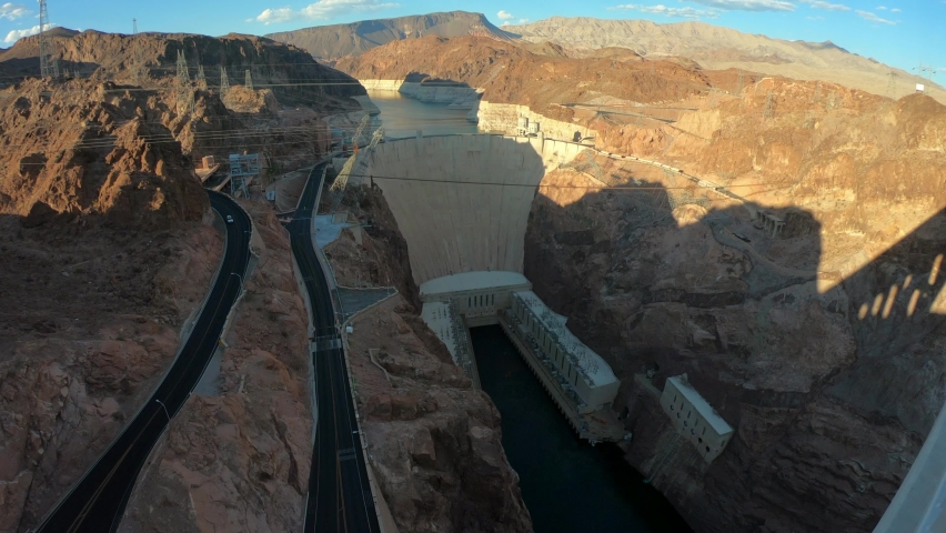 PAN SLOW MOTION SHOT - Hoover Dam is a concrete arch-gravity dam in the Black Canyon of the Colorado River, on the border between the U.S. states of Nevada and Arizona.