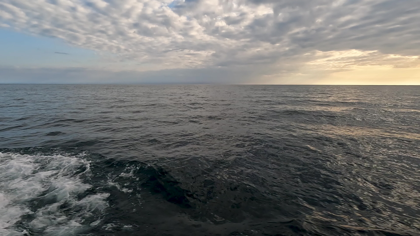Slow motion views of a boat gliding through majestic Lake Superior. Located between Copper Harbor and Isle Royale in the Upper Peninsula of Michigan.