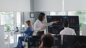 Financial manager discuss graphs on multiple screens with analyst in modern finance company. Diverse brokers monitoring stock market data in modern office - Powered by Shutterstock - Get 15% off with code: PIKWIZARD15