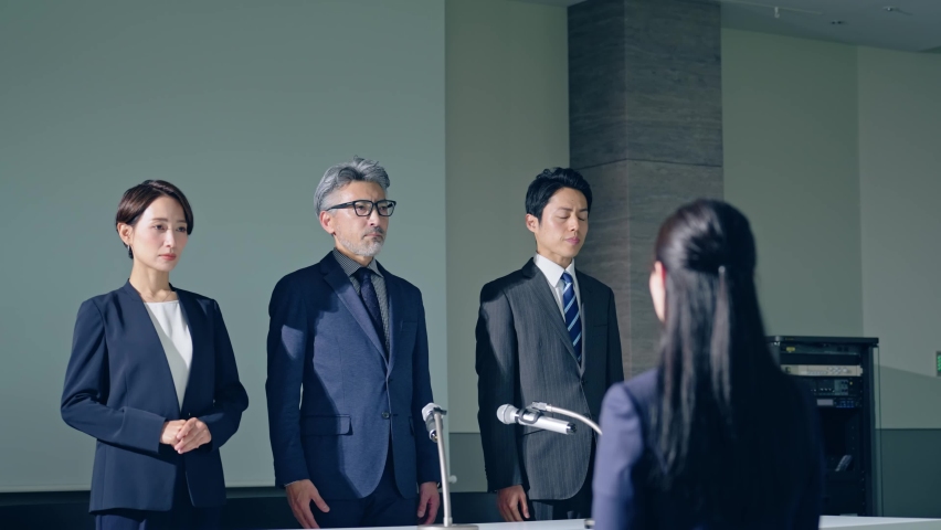 Group of Asian people giving an apology press conference. Royalty-Free Stock Footage #1094278945