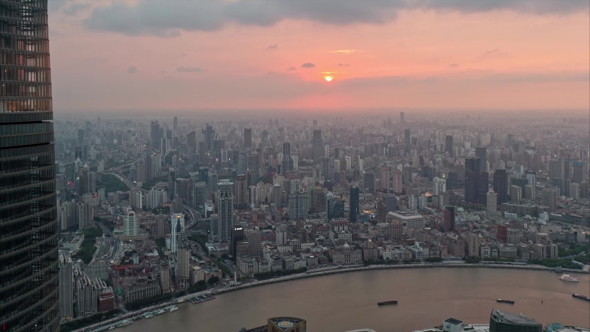 Shanghai, China - Sept. 11, 2022: Time lapse of sunset at shanghai bund, aerial view of bund skyline from day to night, beautiful cityscape video, 4k footage.