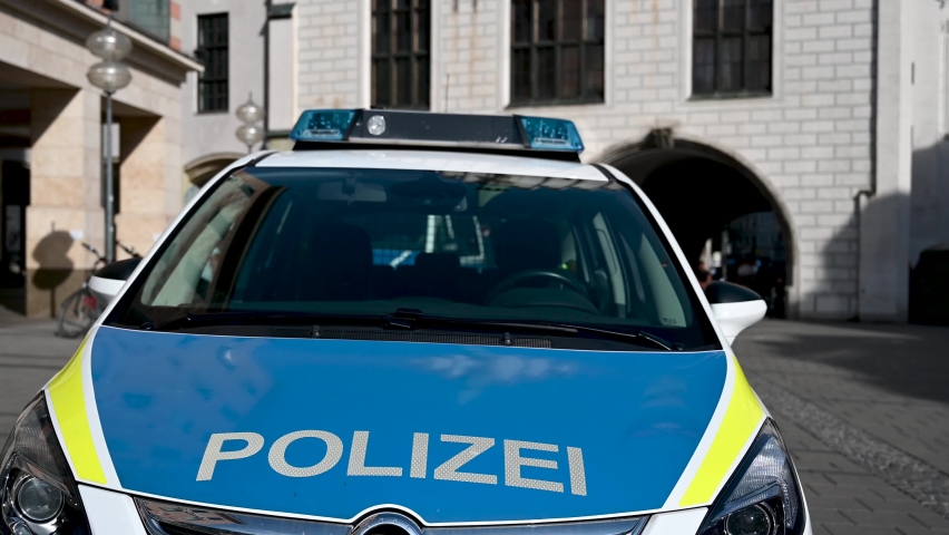 Police patrol car parked on the street in Germany. German police car on the street. Front view of a police car with the lettering "Polizei". 