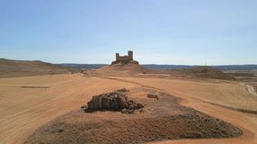 Aerial zenithal video of an old ruined castle in Spain Europe medieval time without people dry arid open landscape montuenga soria