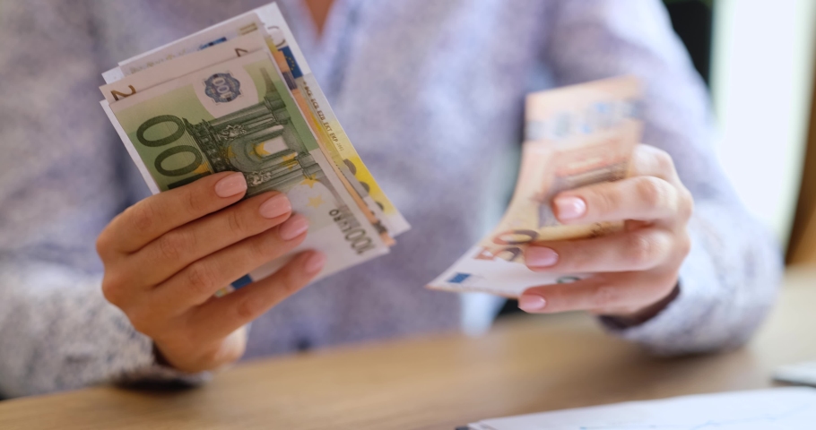 Closeup of female hands holding and counting euro banknotes Royalty-Free Stock Footage #1094292419