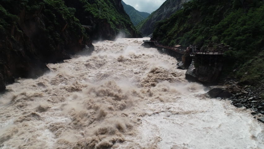 Drone shot of spectacular Tiger Leaping Gorge and Jinsha river, a primary tributary of the Yangtze, nature and tourism China Royalty-Free Stock Footage #1094292879