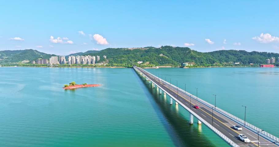 Aerial footage of Thousand Island Lake natural scenery in Hangzhou, Zhejiang Province, China. Clean lake and mountain with bridge scenery.