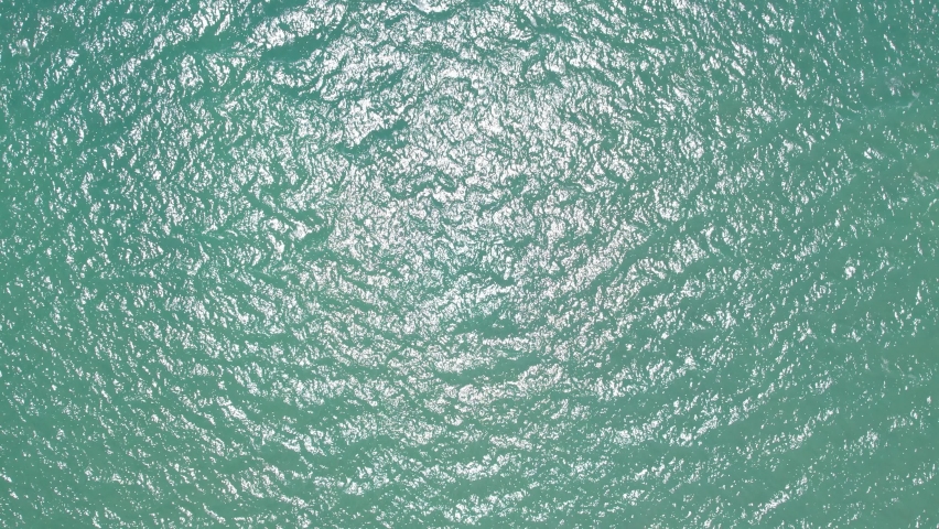 Beautiful sea background summer landscape, Waves sea water surface High quality video Bird's eye view, Drone fly over sea surface high angle view, Top down Royalty-Free Stock Footage #1094299909