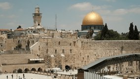 A telephoto video in midday, of the Western Wall, and al-Aqsa Mosque right above it, at the old city of Jerusalem. an NTSC video clip, Jerusalem, Israel.