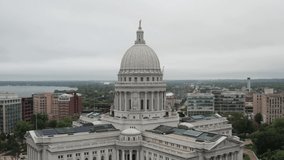 Wisconsin state capitol building in Madison, Wisconsin with drone video close up in a circle.