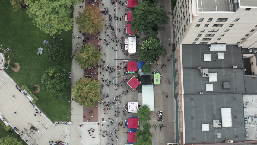 People attending Taste of Madison food festival in Madison, Wisconsin with drone overhead view.