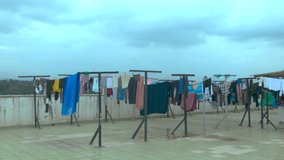 Clothes Hanging Outside On A Roof Top To Dry