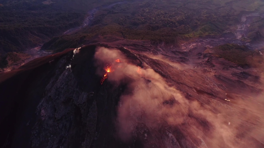 Flyover of the crater of Fuego, one of Guatemala's active volcanos. Shot ends with camera right above crater. More from this sequence available for sale.  | Shutterstock HD Video #1094313439