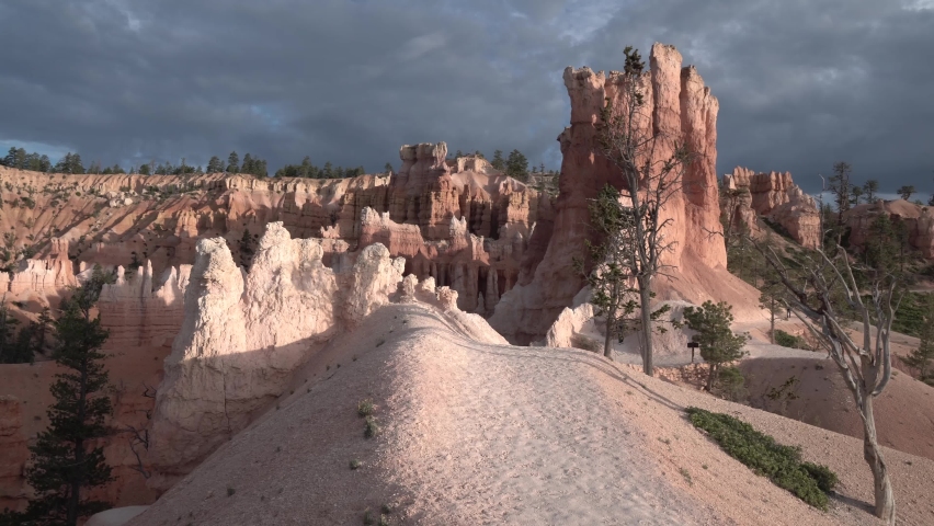 Queens Garden rock formations at Bryce Canyon national park Utah, Aerial pedestal rising shot