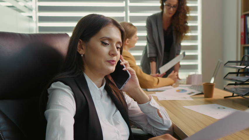 Business woman on phone call sharing results with shareholders. Easy people acces by using nowadays gadgets. Technology concept. Royalty-Free Stock Footage #1094316901