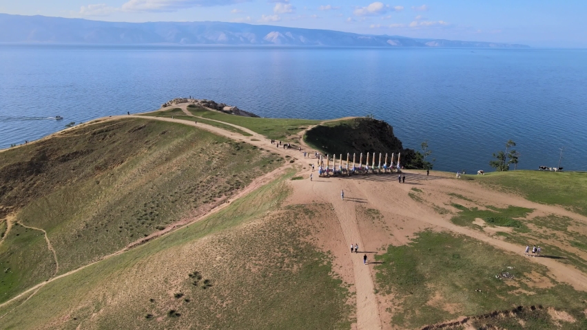 Aerial view on cape Burkhan and 13 pillars of Serge on Olkhon island. Summer landscape of lake Baikal. Famous tourist spot in Eastern Siberia.