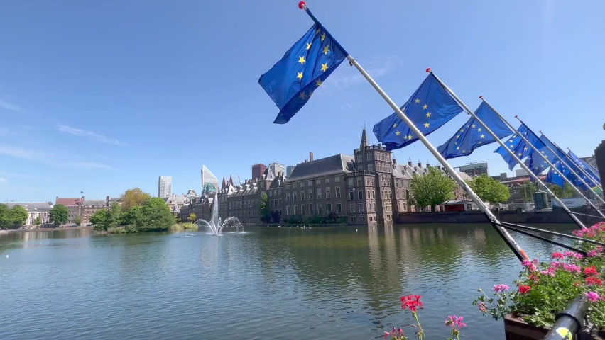 View of Binnenhof. Dutch government and office of Prime minister. Europen Union (EU) flags are waving in front. Running fountain. Den Haag skyline. The Hague, South Holland, Netherlands
