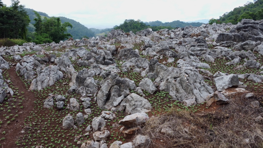 Aerial view of small rocks or sedimentary rock on a cliff in northern Thailand. Background and texture of mountain layers, Rocky mountain cliffs.