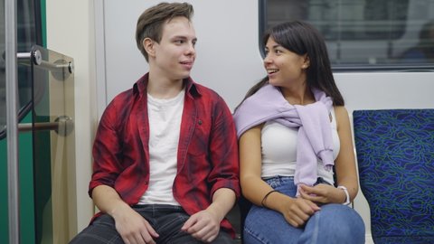 Guy Young Woman Sitting Subway Car Stock Footage Video (100% Royalty