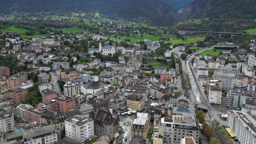 An aerial view of the city of Brig in Switzerland. In the scene you can see the church of Brig and Stockalper Castle