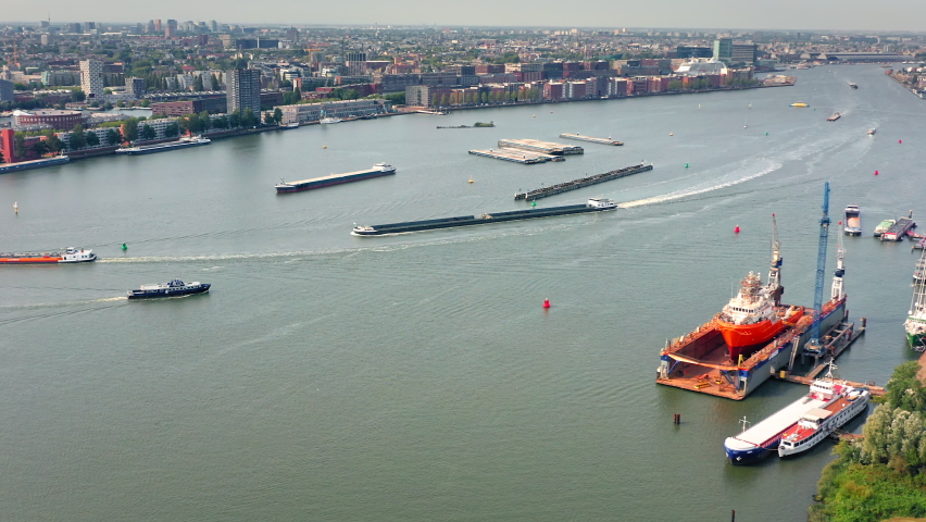 North sea canal in Amsterdam, The Netherlands, cargo barge transportation and shipyard