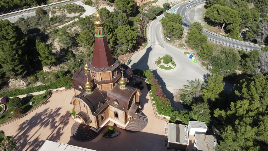 Russian Orthodox Church, gorgeous golden spire tops in a green mountain valley.