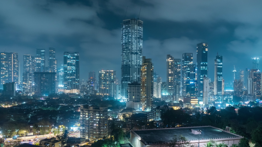Time Lapse of Clouds over the city of Mumbai at Night time, Wide cityscape view, High Rise buildings and skyscrapers, Mumbai, Maharashtra, India