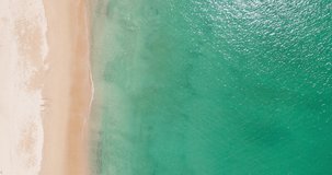 Top-down beach sand island Phuket ocean wave Aerial video beautiful closeup shot beach and seawater on wave on sand in sunset time (Top-view) nature and travel concept video. Professional video 4K
