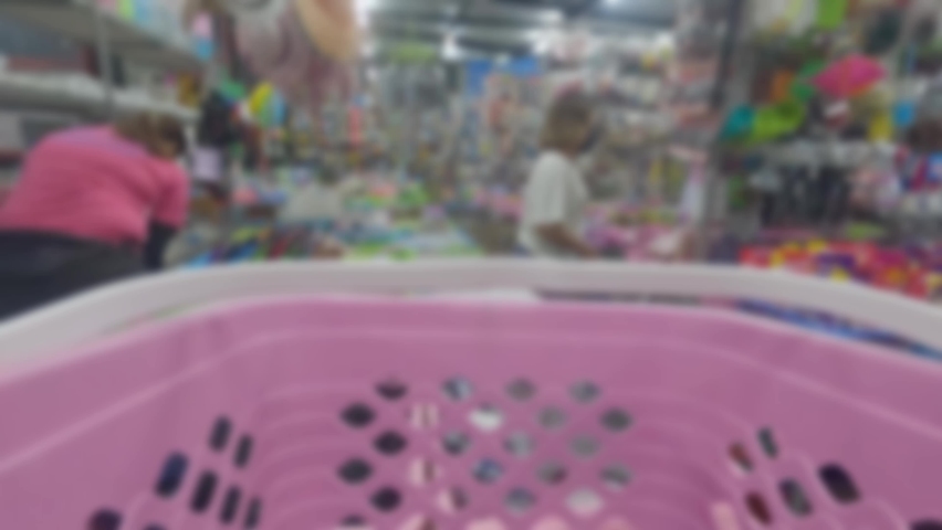 Blurred view of the atmosphere walking at a local market outside Thailand in the early evening.